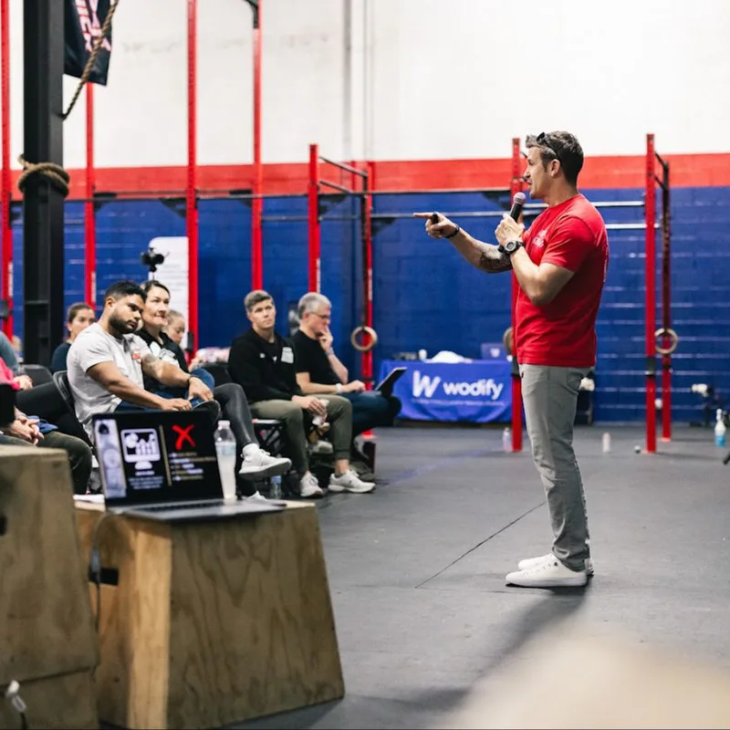 Jason Fernandez teaching affiliate owners at a CrossFit event
